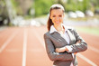 Business woman at athletic stadium