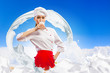 Photo: Asian female cook against milk splashes Asian female cook against milk splashes