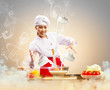 Photo: Asian female cooking with magic Asian female cooking with magic
