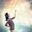 Woman touching virtual screen