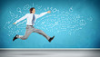 Jumping young businessman