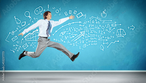 Photo: Jumping young businessman Jumping young businessman