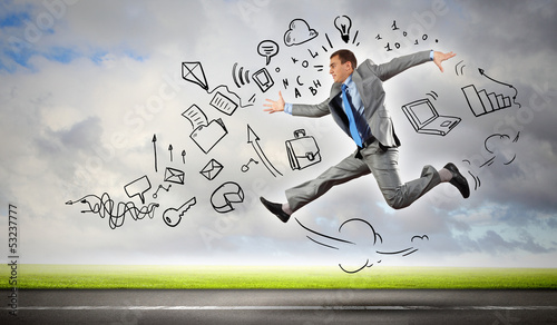 Photo: Jumping young businessman Jumping young businessman