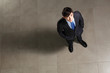 Young businessman looking above