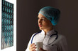 Woman doctor examining x-ray