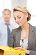 young attractive businesswoman with folders