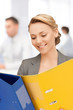 Photo: young attractive businesswoman with folders young attractive businesswoman with folders