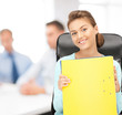 young attractive businesswoman with folders