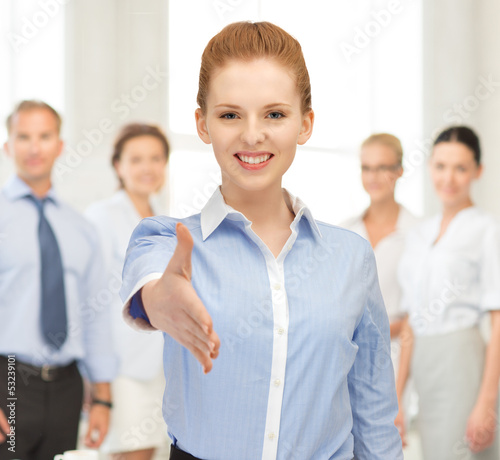 Photo: woman with an open hand ready for handshake woman with an open hand ready for handshake