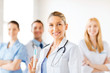 female doctor holding syringe with injection