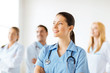 female doctor in front of medical group