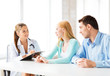 Photo: doctor with patients in cabinet doctor with patients in cabinet