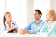 doctor with patients in cabinet