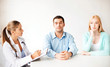 doctor with patients in cabinet