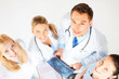 young group of doctors looking at x-ray