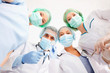 Photo: group of doctors in operating room group of doctors in operating room