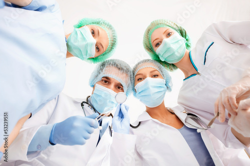 Photo: group of doctors in operating room group of doctors in operating room