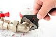 Men hands with spanner installing a counter