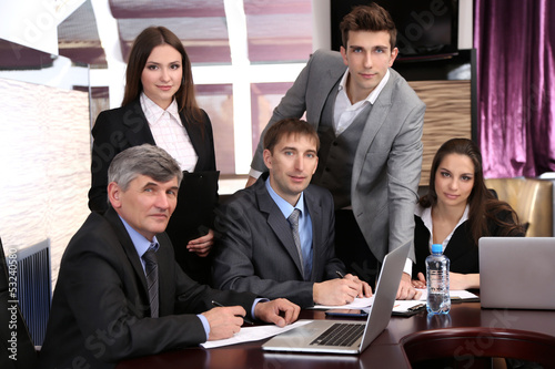 Photo: Business people working in conference room Business people working in conference room