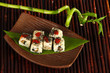 Tasty Maki sushi - Roll on plate on bamboo mat