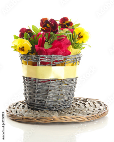 Photo: Beautiful pansies in basket isolated on white Beautiful pansies in basket isolated on white