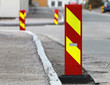 Red and yellow striped caution road sign