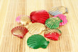 Colorful seashells on bamboo mat background