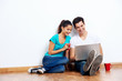couple laptop floor