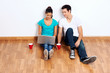 couple laptop floor