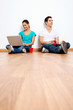 couple laptop floor