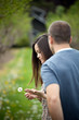 Photo: Woman Holding a Dandelion Woman Holding a Dandelion