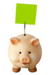 Photo: Freundliches lachendes Sparschwein und leeres Notizzettel Freundliches lachendes Sparschwein und leeres Notizzettel
