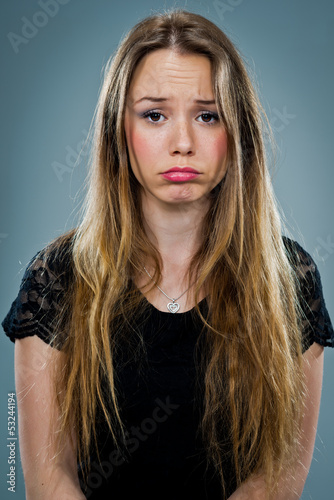 Photo: Young Woman with Sad Expression Young Woman with Sad Expression