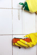 Cleaning of dirty old tiles in a bathroom