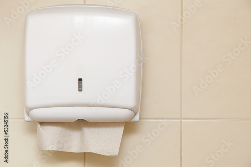 Photo: Paper towel dispenser in the bathroom Paper towel dispenser in the bathroom