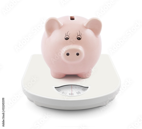 Photo: Piggy bank on scales Piggy bank on scales