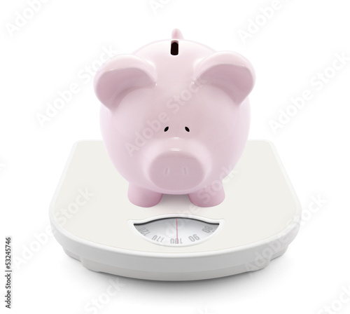 Photo: Piggy bank on scales Piggy bank on scales