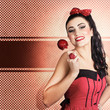 Photo: Sweet candy pinup girl with vintage toffee apple Sweet candy pinup girl with vintage toffee apple