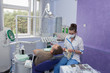 Dentist and patient.