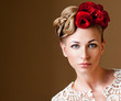 fashion model with hairstyle and flowers in her hair.