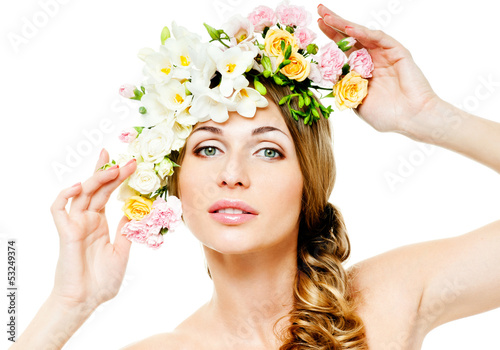 Photo: beautiful woman with flowers in her hair beautiful woman with flowers in her hair