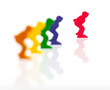 Five colored pawns isolated on a white background