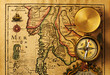 Photo: Antique compass over old map Antique compass over old map