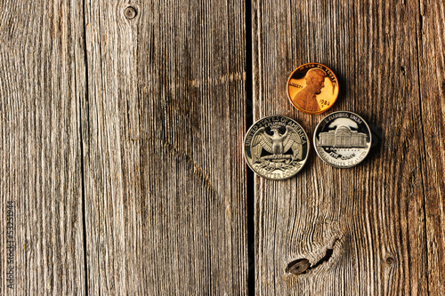 Photo: US cent coins over wooden background US cent coins over wooden background