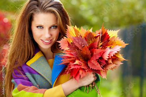 Photo: autumn woman on leafs background autumn woman on leafs background