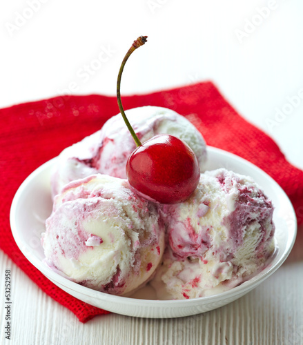 Photo: three ice cream balls with fresh red cherry three ice cream balls with fresh red cherry