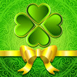 Green background with clover leaves and gold ribbon