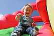 Photo: Child on inflatable bouncy castle slide Child on inflatable bouncy castle slide