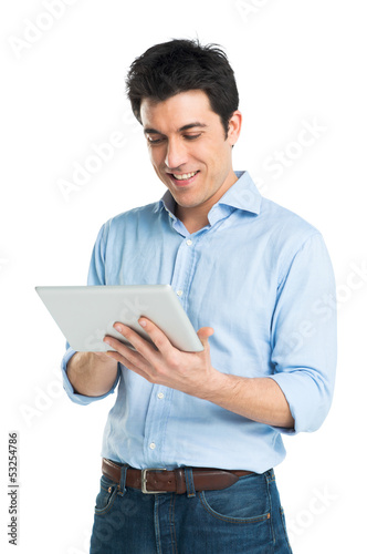 Photo: Happy Young Man Using Digital Tablet Happy Young Man Using Digital Tablet