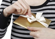 Young woman holding a present